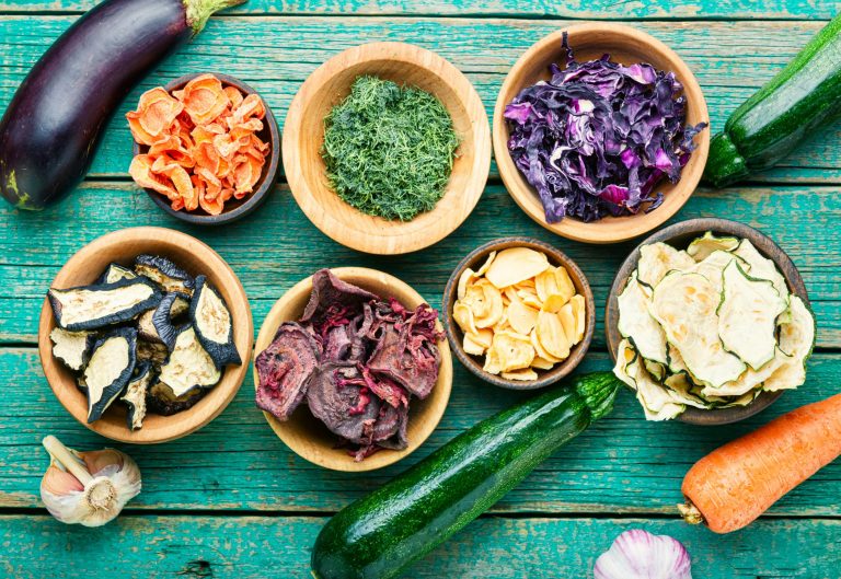 Dried vegetables arranged on a green table